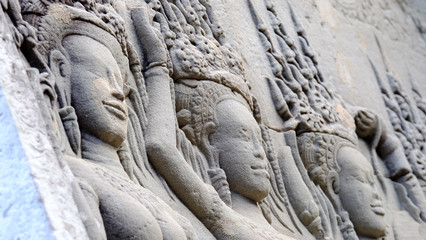 Fototapeta na wymiar Apsara girls on the wall of Angkor Wat with shade of light, Siem Reap, Cambodia