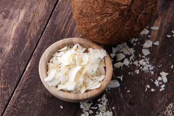 Coconut flakes with whole coconut. Tropical food concept.