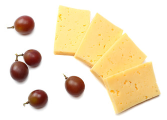 piece of cheese with grapes isolated on white background