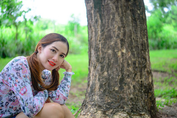Portrait of thai woman under tunnel tree,asian woman in the forest