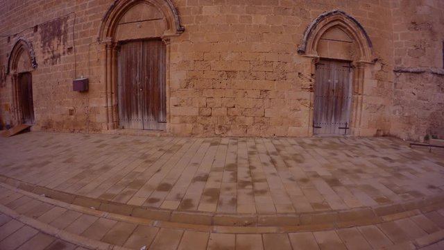 closed wooden doors in a thousand-year-old temple in the center of the fortress of Famagusta