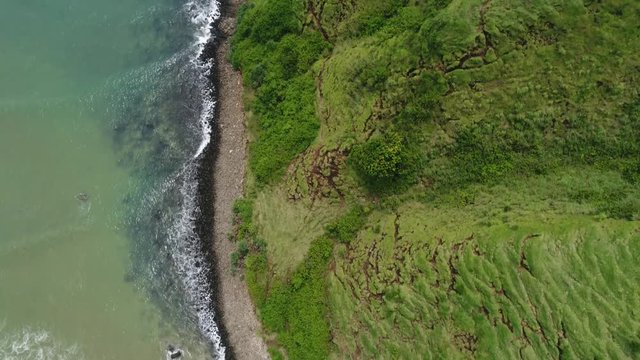 aerial drone moving forwards over Bali coast Lompoc 4k ocean landscape 