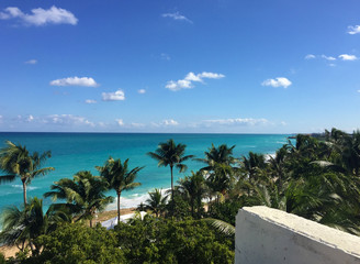 Fototapeta na wymiar Beautiful ocean view from the balcony. Palm trees, ocean, Atlantic coast of Cuba