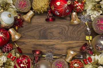 Christmas decorations ornament, new year toys of red and gold colors on wooden background, xmas winter holidays and celebrations concept 