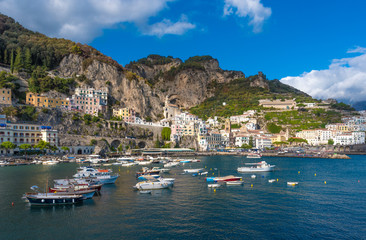 Fototapeta na wymiar Amalfi, Italy - The awesome historic center of the touristic town in Campania region, Gulf of Salerno, southern Italy. This small town gives its name to the Amalfi Coast.