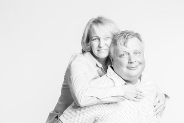 Family couple, wife sitting on her husband's back