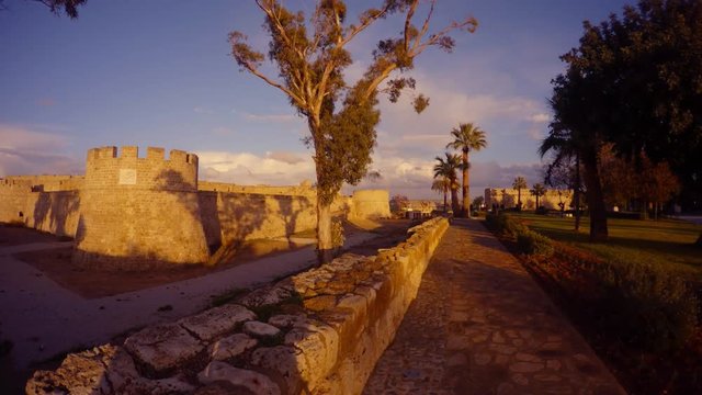 walls of a medieval fortress and a ruined Christian Roman temple