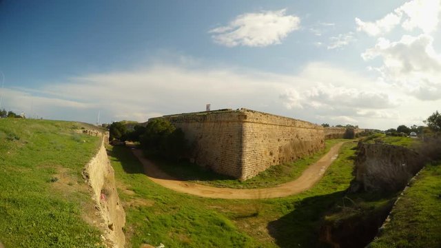 road next to corner Famagusta City Walls, a deep moat surrounds the old fortress