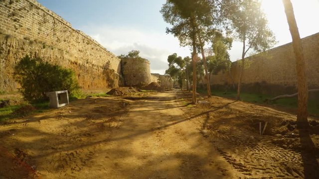 a deep moat of the medieval fortress of Famagusta and trees