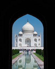 Taj Mahal through Arched Doorway Entrance In Agra, India