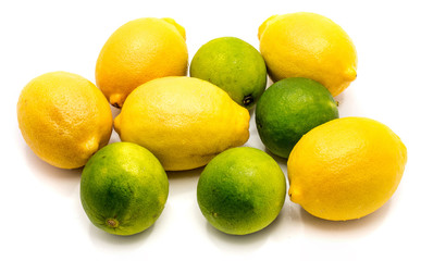 Group of several whole lemons and limes isolated on white background .