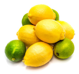 Group of several whole lemons and limes isolated on white background .