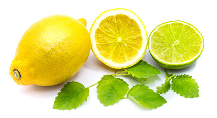 One whole lemon, lemon and lime halves with fresh lemon balm leaves isolated on white background.