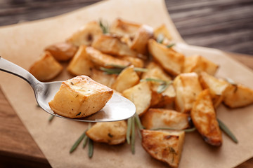 Spoon with potato piece, closeup