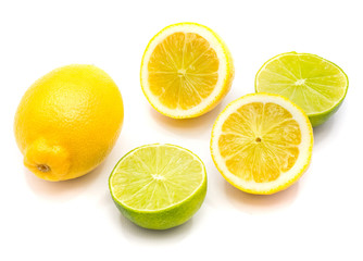 One whole lemon, two lemon and lime halves isolated on white background.