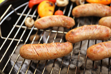 Sausages on barbecue grill