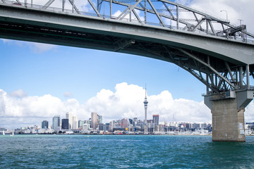 Fototapeta premium view of Auckland CBD, city center, with sky tower from under the bridge, new zealand