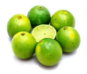 Group of whole lime in the shape of flower and half in the centre isolated on white background.