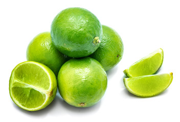 Group of whole green half and two slices isolated on white background.