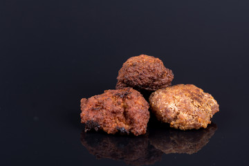 Meatballs isolated above black background with reflections and c