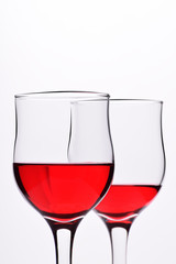 Glasses with red wine on a white background