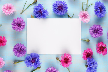 Greeting card on floral background with cornflowers