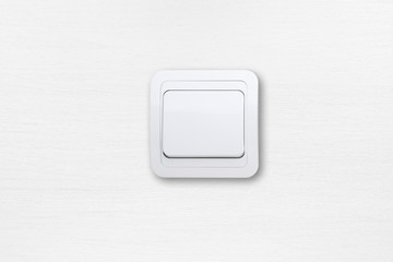 Light switch on white wall