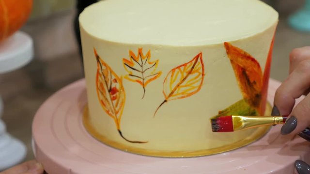 Hand decorated cake brush food colors. Close-up