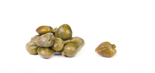 Marinated capers isolated on white background. Canned capers. Macro