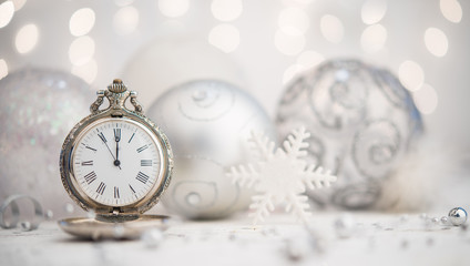 Siler christmas ornaments and pocket watch shows new year