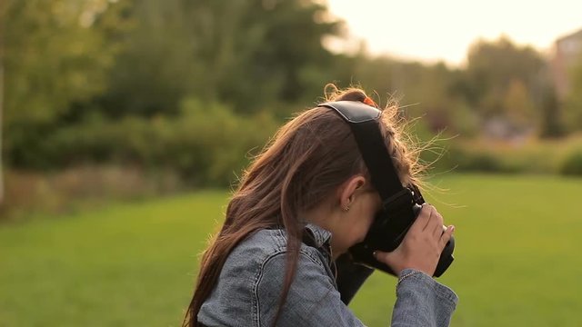 Funny little girl using a virtual reality VR helmet. She very impressed