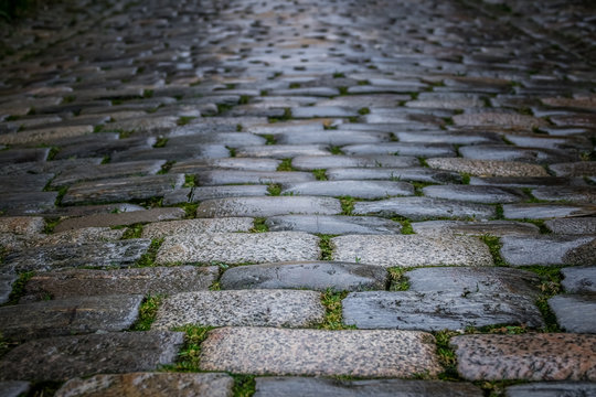 Fototapeta Pattern of a cobblestones on a road