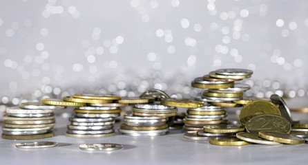 Many stacked coins. Money box. Close-up.
