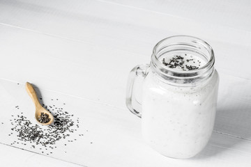 white cocktail with chia seeds, Salvia hispanica