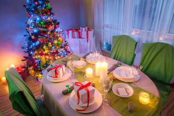 Christmas table setting for Christmas eve in evening