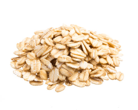 Oat Cereal. Pile of grains, isolated white background.