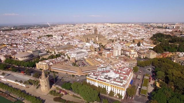 Seville city aerial view including the Cathedral and Torre del Oro in Sevilla, Andalusia, Spain.