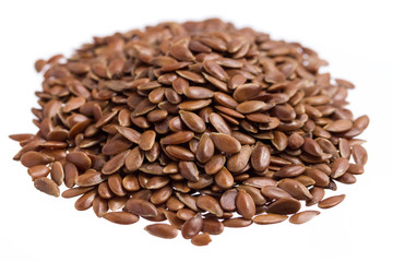 Brown Flax. Pile of grains, isolated white background.