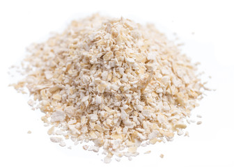 Oat cereal. Pile of grains, isolated white background.