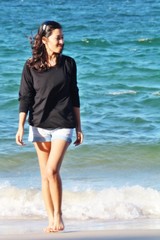Lady walk on  white beach sand sea sun 