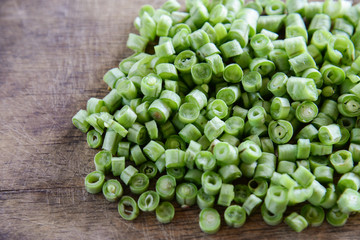 Sliced yard long bean vegetable on wooden block.long bean preparation in thai kitchen.
