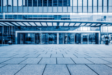 empty pavement front of the modern office entrance.