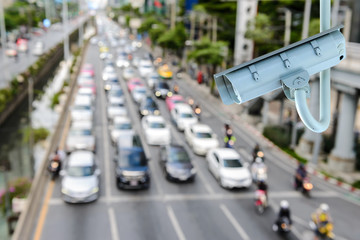 CCTV Security camera with blurring traffic jam in bangkok city, Thailand