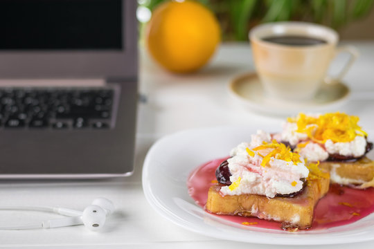 French fried bread with plum jam, cottage cheese cream and orange marmalade from the laptop.