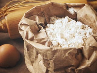 Baking flour with rolling pin and egg