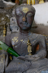 Buddhist Statue in Pak Ou Caves, Luang Prabang, Laos.