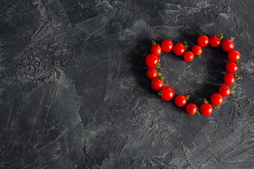 Heart of a cherry tomato on a dark background