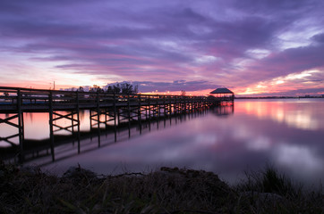Fototapeta na wymiar Colorful sunset by a Florida pier