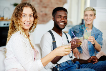 Gathering of intercultural friends at cocktail home party
