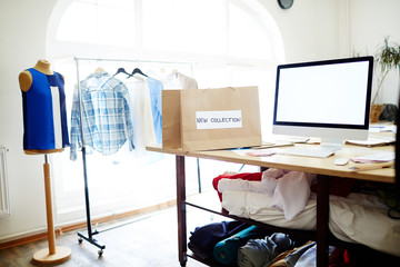 Empty workroom and workplace of tailor or vendor of clothes in small boutique